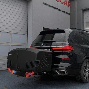 Samoch&oacute;d osobowy BMW X7 G07 z box transportowy Towbox V3 Black po wykonanym montażu haka holowniczego można zamontować taki box jako zwiększenie przestrzeni bagażowej samochodu 